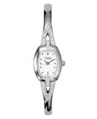 A twist of elegance takes this Caravelle by Bulova timepiece to the next level of style. Mixed metal bangle bracelet with crystal detailing and mixed metal case. Crystal-accented bezel. White dial with logo and circle markers. Quartz movement. Water resistant to 30 meters. Two-year limited warranty. A twist of elegance takes this Caravelle by Bulova timepiece to the next level of style. Mixed metal bangle bracelet with crystal detailing and mixed metal case. Crystal-accented bezel. White dial with logo and circle markers. Quartz movement. Water resistant to 30 meters. Two-year limited warranty.