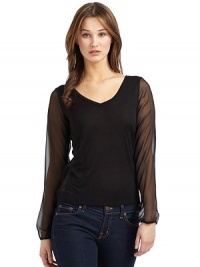 THE LOOKPullover styleV-neckLong sheer elastic cuff sleevesSheer side panelsTHE FITAbout 24 from shoulder to hemTHE MATERIALHammered silk charmeuseCARE & ORIGINDry cleanMade in USAModel shown is 5'9½ (176cm) wearing US size Small. THE LOOKPullover styleV-neckLong sheer elastic cuff sleevesSheer side panelsTHE FITAbout 24 from shoulder to hemTHE MATERIALHammered silk charmeuseCARE & ORIGINDry cleanMade in USAModel shown is 5'9½ (176cm) wearing US size Small.