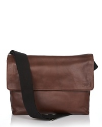 Flap messenger bag with logo patch on flap. Adjustable strap. Adjustable snap closure on flap. Front slip pocket and zip pocket inside. Flap messenger bag with logo patch on flap. Adjustable strap. Adjustable snap closure on flap. Front slip pocket and zip pocket inside.