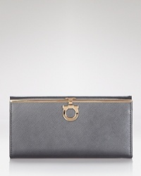 A bestselling silhouette from Salvatore Ferragamo. This luxurious wallet in scratch-resistant leather lends polished sophistication to your everyday looks. A bestselling silhouette from Salvatore Ferragamo. This luxurious wallet in scratch-resistant leather lends polished sophistication to your everyday looks.