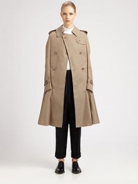 A cutting-edge riff on the classic trench defines this modern cape design.Foldover collarEpaulettesButton gunflapDouble-breasted button detailsTacked-down faux sleeves with buckle cuffsButton-down rainflapBack vent with inner tab closureFully linedAbout 36 from shoulder to hemCottonDry cleanImportedModel shown is 5'9½ (176cm) wearing US size Small. A cutting-edge riff on the classic trench defines this modern cape design.Foldover collarEpaulettesButton gunflapDouble-breasted button detailsTacked-down faux sleeves with buckle cuffsButton-down rainflapBack vent with inner tab closureFully linedAbout 36 from shoulder to hemCottonDry cleanImportedModel shown is 5'9½ (176cm) wearing US size Small.