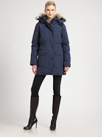 Designed with a woman's body in mind, this duck-feather down coat has storm flaps and a mid-thigh length.