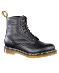 This pair of men's boots is pure Dr. Martens--funky modern boots for men crafted in quality leather, with their signature yellow topstitching and logo tag at heel. Imported. This pair of men's boots is pure Dr. Martens--funky modern boots for men crafted in quality leather, with their signature yellow topstitching and logo tag at heel. Imported.
