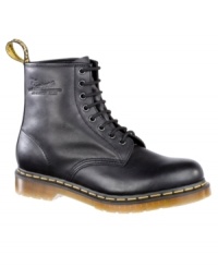 This pair of men's boots is pure Dr. Martens--funky modern boots for men crafted in quality leather, with their signature yellow topstitching and logo tag at heel. Imported.