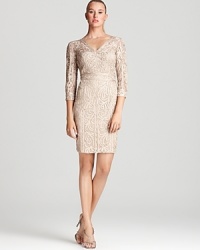 Sue Wong's lace dress lends a classic look in a timeless hue and double v-neck silhouette. Sue Wong's lace dress lends a classic look in a timeless hue and double v-neck silhouette.