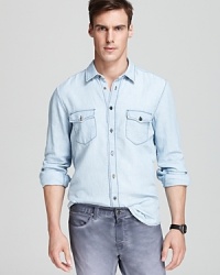 Contrast stitching and double chest pockets add dramatic edge to this classic-fit sport shirt from BOSS Orange. Contrast stitching and double chest pockets add dramatic edge to this classic-fit sport shirt from BOSS Orange.