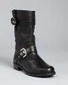 Stuart Weitzman keeps these moto boots in neutral gear, with hardware that stands out without being overly tough.