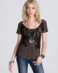 A little tough love goes a long way with this Free People tee, complete with edgy rhinestone and lace embellishments. A little tough love goes a long way with this Free People tee, complete with edgy rhinestone and lace embellishments.
