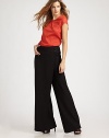 EXCLUSIVELY AT SAKS. A simply stunning interpretation of the classic wide-leg pant, constructed with fluid lines and a sleek wrap-front panel.Button-front wrap panelWide waistbandWide legsSide zipperRise, about 11Inseam, about 3570% polyester/30% rayonDry cleanImportedModel shown is 5'10 (177cm) wearing US size 4.ABOUT THE DESIGNER Former fourth-grade schoolteacher Kara Laricks always told her students to be true to themselves. 