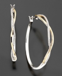 Beautiful classic diamond hoops with a twist. These diamond earrings feature sparkling round-cut diamonds (1/5 ct. t.w.) set in 14k gold and sterling silver. Approximate diameter: 1-1/8 inches.