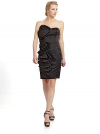 A sleek silhouette in elegant satin with a voluminous cascading ruffle along one side.Sweetheart neckline Shaped bodice with boning Princess seams, front and back Ruffle trim Back zipper Center back slit at hem Fully lined About 35 from shoulder to hem Polyester Dry clean Imported A sleek silhouette in elegant satin with a voluminous cascading ruffle along one side.Sweetheart neckline Shaped bodice with boning Princess seams, front and back Ruffle trim Back zipper Center back slit at hem Fully lined About 35 from shoulder to hem Polyester Dry clean Imported