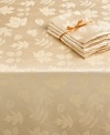 Elegance with an autumnal twist. Featuring a leafy damask pattern in warm ivory, the round Dinner Party Bountiful tablecloth outfits your harvest table in seasonal splendor. (Clearance)
