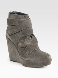 Smooth velour leather style is defined by wrap-around straps and a high, covered wedge and platform.Self-covered wedge heel, 4½ (110mm)Covered platform, 1 (25mm)Compares to a 3½ heel (90mm)Wrap-around, grip-tape strapsLeather liningPadded insoleExclusive initial rubber soleMade in Spain Smooth velour leather style is defined by wrap-around straps and a high, covered wedge and platform.Self-covered wedge heel, 4½ (110mm)Covered platform, 1 (25mm)Compares to a 3½ heel (90mm)Wrap-around, grip-tape strapsLeather liningPadded insoleExclusive initial rubber soleMade in Spain