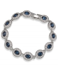 A fashionista's dream. This Carolee bracelet features oval-cut blue glass stones surrounded by smaller clear accents. Linked together in a silver tone imitation rhodium mixed metal setting. Approximate length: 7 inches. A fashionista's dream. This Carolee bracelet features oval-cut blue glass stones surrounded by smaller clear accents. Linked together in a silver tone imitation rhodium mixed metal setting. Approximate length: 7 inches.