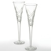 Graduation, retirement, promotion, brithdays, what better way to celebrate than to toast with champagne-filled glasses. These Waterford Crystal flutes feature a cut pattern reminiscent of stars and streamers. Lift these flutes high and honor each occasion with the elegance of Waterford Crystal. Set of 2; 5 oz.