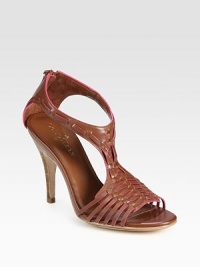 Tribal-inspired leather design with a skinny, stacked heel and exposed back zipper. Stacked heel, 4 (100mm)Leather upperExposed back zipperLeather lining and solePadded insoleImportedOUR FIT MODEL RECOMMENDS ordering true size. Tribal-inspired leather design with a skinny, stacked heel and exposed back zipper. Stacked heel, 4 (100mm)Leather upperExposed back zipperLeather lining and solePadded insoleImportedOUR FIT MODEL RECOMMENDS ordering true size.