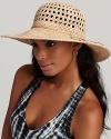 A natural raffia wide brim hat with an open crochet top gives a textural edge to your favorite ensemble.