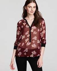 A modern floral print adorns this breezy Aqua blouse. Team with your black basics for the office, or pair with denim for weekend brunch. A modern floral print adorns this breezy Aqua blouse. Team with your black basics for the office, or pair with denim for weekend brunch.