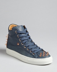 Designer Ruthie Davis® takes her edgy aesthetic into high top sneakers that are long on style, punched up with spike accents. Designer Ruthie Davis® takes her edgy aesthetic into high top sneakers that are long on style, punched up with spike accents.