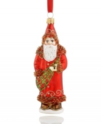 Gilded in a Gaelic sash of red and green, this glass ornament from Vaillancourt offers a historic take on the lovable gift-giving Santa Clause of present day. Delicately crafted with beaded and sparkling details for a brilliant addition to any Christmas tree. Gilded in a Gaelic sash of red and green, this glass ornament from Vaillancourt offers a historic take on the lovable gift-giving Santa Clause of present day. Delicately crafted with beaded and sparkling details for a brilliant addition to any Christmas tree.