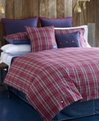 Into the plaid. A red and navy plaid pattern accented with decorative buttons embellishes this Bear Mountain comforter set from Tommy Hilfiger for a look of rustic charm. Reverses to navy stripes.