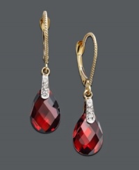 Add some sizzle with red-hot color. These dramatic drop earrings feature pear-cut garnet (7-1/5 ct. t.w.) and sparkling diamond accents. Crafted in 14k gold. Approximate drop: 1-1/4 inches. Add some sizzle with red-hot color. These dramatic drop earrings feature pear-cut garnet (7-1/5 ct. t.w.) and sparkling diamond accents. Crafted in 14k gold. Approximate drop: 1-1/4 inches.
