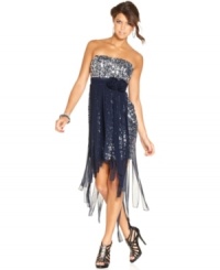 Abundant in razzle-dazzle style, this strapless dress from City Studios wows with its silver sequins and overlay of soft, chiffon strips. Abundant in razzle-dazzle style, this strapless dress from City Studios wows with its silver sequins and overlay of soft, chiffon strips.