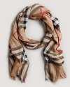 This classic Burberry check scarf keeps you warm and stylish.