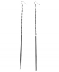 A chain reaction of pure style. These long double-chain earrings from GUESS features a twisted design, set in imitation rhodium-plated mixed metal. Approximate drop: 8-1/2 inches. A chain reaction of pure style. These long double-chain earrings from GUESS features a twisted design, set in imitation rhodium-plated mixed metal. Approximate drop: 8-1/2 inches.