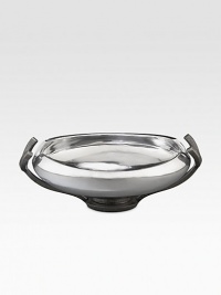 Crafted from stunning metal alloy, this lovely bowl artfully frames whatever you put in it with a gently curling lip, glossy shine and graceful pedestal base. From the Anvil Collection Iron-finish metal alloy 2-quart capacity 14¼W X 4H X 10D Hand wash Imported Crafted from stunning metal alloy, this lovely bowl artfully frames whatever you put in it with a gently curling lip, glossy shine and graceful pedestal base. From the Anvil Collection Iron-finish metal alloy 2-quart capacity 14¼W X 4H X 10D Hand wash Imported