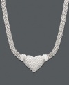 A modern spin on a traditional heart pendant. A gift she will treasure forever, necklace features a unique woven mesh chain with a heart dusted in sparkling diamond (1/2 ct. t.w.). Crafted in sterling silver. Approximate length: 18 inches. Approximate drop: 1 inch.