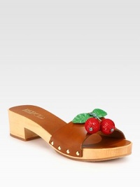 A wooden heel elevates this studded leather design, topped with glistening sequin-coated cherries. Wooden heel, 1¾ (45mm)Leather upper with sequin embellishment and metal studsLeather liningRubber solePadded insoleMade in Italy A wooden heel elevates this studded leather design, topped with glistening sequin-coated cherries. Wooden heel, 1¾ (45mm)Leather upper with sequin embellishment and metal studsLeather liningRubber solePadded insoleMade in Italy