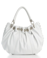 A drawstring chain weaves through the sleek Busybody satchel, while studs embellish the sides and braids wrap around the straps - a great option for on-the-go drama. A drawstring chain weaves through the sleek Busybody satchel, while studs embellish the sides and braids wrap around the straps - a great option for on-the-go drama.