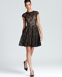 Metallic flecked lace lends a festive look to Shoshanna's L.B.D., detailed with delicate pleating for femininity. Metallic flecked lace lends a festive look to Shoshanna's L.B.D., detailed with delicate pleating for femininity.