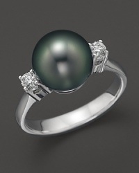 A timeless classic, this Tara Pearls ring combines 18K white gold with a stunning Tahitian black pearl detailed with two sparkling diamonds. A timeless classic, this Tara Pearls ring combines 18K white gold with a stunning Tahitian black pearl detailed with two sparkling diamonds.