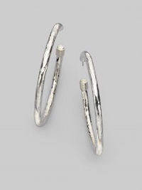 Slender sterling silver hoops with a lustrous hammered finish and cuffed caps. Sterling silver Diameter, about 2 Post back Imported Slender sterling silver hoops with a lustrous hammered finish and cuffed caps. Sterling silver Diameter, about 2 Post back Imported
