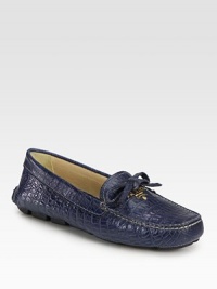Crocodile-stamped leather silhouette with bow and logo detail. Crocodile-stamped leather upperLeather liningRubber solePadded insoleMade in Italy Crocodile-stamped leather silhouette with bow and logo detail. Crocodile-stamped leather upperLeather liningRubber solePadded insoleMade in Italy