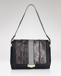 An embossed leather handbag by Juicy Couture is a perfectly crafted take on this season's tactile mood. A magnetic snap secures the top and opens to a lined interior with 4 pockets. An embossed leather handbag by Juicy Couture is a perfectly crafted take on this season's tactile mood. A magnetic snap secures the top and opens to a lined interior with 4 pockets.
