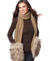 Cozy up for a long winter in style. Layer on this soft knit scarf by MICHAEL Michael Kors and let cold fingers find a home in the faux fur pockets at each end.