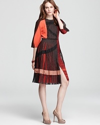 BCBGMAXAZRIA's fashion forward Layton dress wows in a color block design, finished with an innovative skirt and mesh accents. BCBGMAXAZRIA's fashion forward Layton dress wows in a color block design, finished with an innovative skirt and mesh accents.