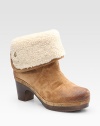 Soft slightly distressed suede clog updated by edgy studs and a plush shearling cuff. Wooden heel, 2½ (65mm) Covered platform, ¾ (20mm) Compares to a 1¾ heel (45mm) Suede upper Genuine shearling cuff Rubber sole Padded insole Imported