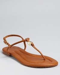 Simply the essence of chic, easy summer style, these slim-strapped flats are equally at home on city streets and sandy beaches. By Tory Burch. Simply the essence of chic, easy summer style, these slim-strapped flats are equally at home on city streets and sandy beaches. By Tory Burch.