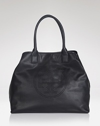 An ever-versatile leather Tory Burch tote is a fail safe daytime choice, detailed with a leather logo medallion. Its spacious lined interior features 3 pockets, secured by a top snap closure.