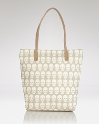 Hit print with this canvas tote from Treesje, splashed in an edgy skull motif. Hard-hitting yet practical, it's a style that's totally to die for. Hit print with this canvas tote from Treesje, splashed in an edgy skull motif. Hard-hitting yet practical, it's a style that's totally to die for.