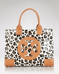 Impossibly effortless, this Tory Burch holdall encapsulates Manhattan cool, crafted of durable coated cotton with leather trims. It's an uptown to downtown accent. Impossibly effortless, this Tory Burch holdall encapsulates Manhattan cool, crafted of durable coated cotton with leather trims. It's an uptown to downtown accent.