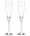 Bands of sparkling rhinestones and silver-plated stems lend modern glamor to Devotion champagne flutes, a beautiful wedding gift from Lenox.