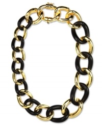 Black and gold for the fashionably bold. This Anne Klein necklace features interlocking links in gold tone mixed metal and plastic jet stone. Approximate length: 18-inches + 2-inch extender.
