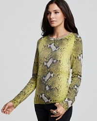 Slither on in to a sweater with style--this Equipment python piece is constructed in soft cashmere for ultimate comfort. Slither on in to a sweater with style--this Equipment python piece is constructed in soft cashmere for ultimate comfort.