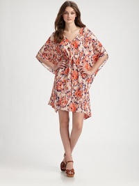 Gorgeous floral silk drapes around the body in an effortless v-neck shift, tucked at the waist for a gathered blouson silhouette.V necklineDropped shouldersDolman sleevesElastic waistAsymmetrical hemAbout 24 from shoulder to hemSilkDry cleanMade in USA of imported fabricModel shown is 5'10 (177cm) wearing US size Small. Gorgeous floral silk drapes around the body in an effortless v-neck shift, tucked at the waist for a gathered blouson silhouette.V necklineDropped shouldersDolman sleevesElastic waistAsymmetrical hemAbout 24 from shoulder to hemSilkDry cleanMade in USA of imported fabricModel shown is 5'10 (177cm) wearing US size Small.