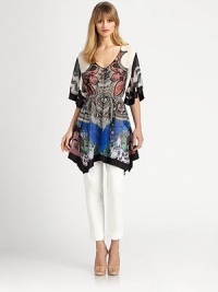 Supple silk, cut in a fluttering poncho silhouette and patterned with a kinetic, colorful paisley print.V necklineFront buttonsShort cape sleevesBanded waistAsymmetrical hemlineAbout 22 from natural waistSilkDry cleanMade in Italy of imported fabricModel shown is 5'11 (180cm) wearing US size Small. Supple silk, cut in a fluttering poncho silhouette and patterned with a kinetic, colorful paisley print.V necklineFront buttonsShort cape sleevesBanded waistAsymmetrical hemlineAbout 22 from natural waistSilkDry cleanMade in Italy of imported fabricModel shown is 5'11 (180cm) wearing US size Small.